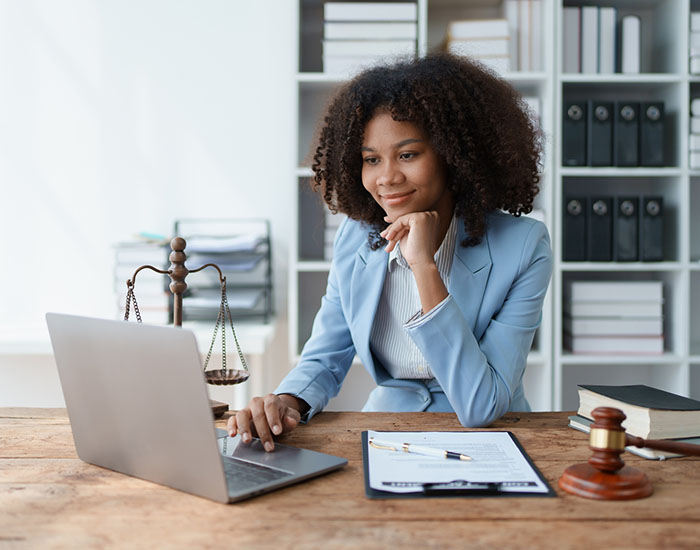 A young women African American lawyer lawsuit studying